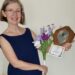 Photo of Lynn Archer in the local press holding 1st prize trophy